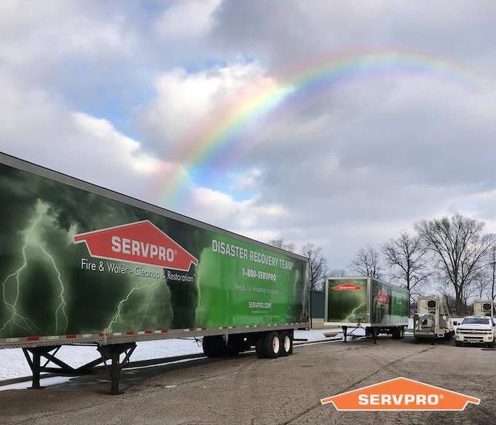 SERVPRO trailers with Rainbow over