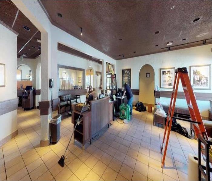 SERVPRO Technicians cleaning up local restaurant after a fire 