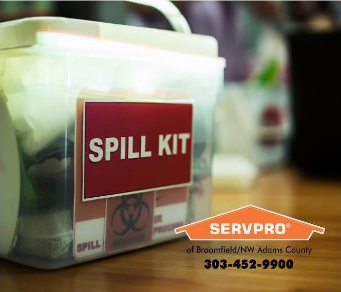 A biohazard spill kit is shown on the desk of a business. 