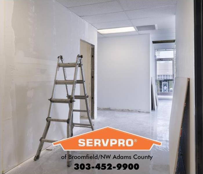 An office building is shown with new drywall and ready is for paint, one of the last steps in the restoration process after a